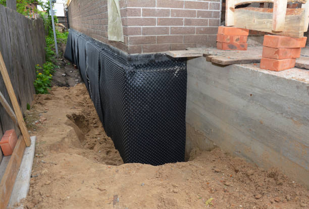 SJ Waterproofing Pros technician performing targeted Exterior Waterproofing assessment in Freedom, PA